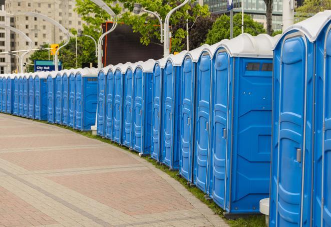 a row of portable restrooms at an outdoor special event, ready for use in Florence, SC